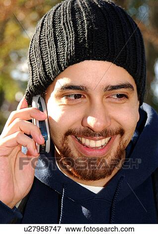 Portrait of a man conversing on his cell phone. View Large Photo Image Stock Photo - Portrait of a man conversing on his cell phone.. Fotosearch