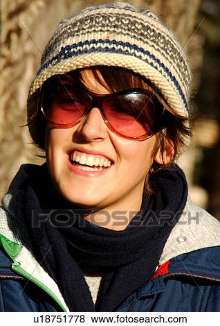 Portrait of a young woman wearing sunglasses. View Large Photo Image Stock Photo - Portrait of a young woman wearing sunglasses.. Fotosearch