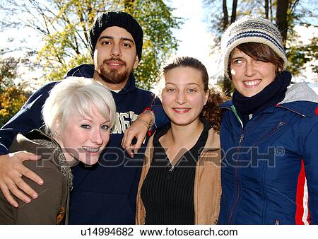 Stock Image - Portrait of four cheerful friends.. Fotosearch