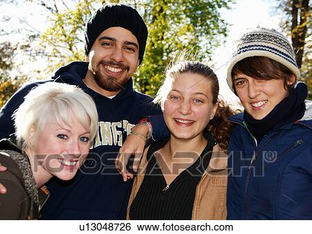 Portrait of four cheerful friends. View Large Photo Image Stock Photograph - Portrait of four cheerful friends.. Fotosearch