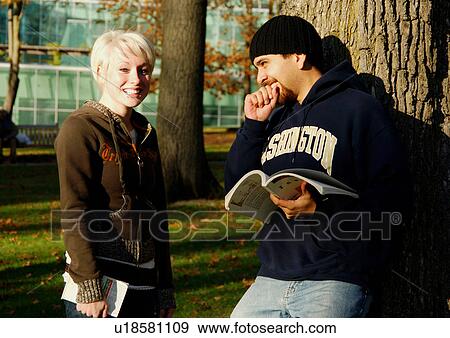 View of a man in conversation with a friend. View Large Photo Image Stock Photo - View of a man in conversation with a friend.. Fotosearch