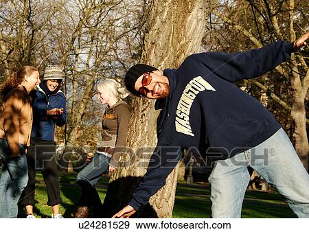 View of a man playfully smiling at the camera. View Large Photo Image Stock Photo - View of a man playfully smiling at the camera.. Fotosearch
