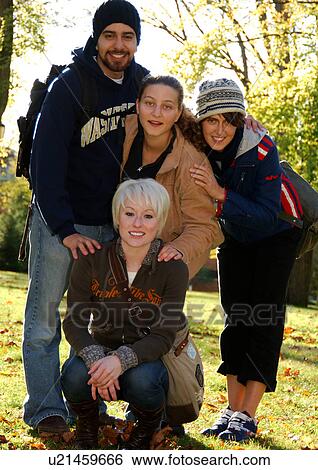 View of four friends posing for the camera. View Large Photo Image Stock Photograph - View of four friends posing for the camera.. Fotosearch