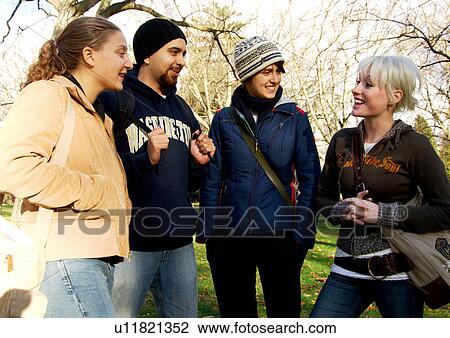 View of four friends spending time together. View Large Photo Image Stock Image - View of four friends spending time together.. Fotosearch