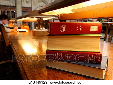 Close-up of a stack of books placed on a table. View Large Photo Image Stock Photo - Close-up of a stack of books placed on a table.. Fotosearch