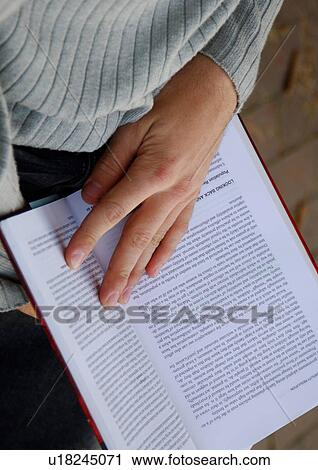 View of a person reading a book. View Large Photo Image Stock Image - View of a person reading a book.. Fotosearch