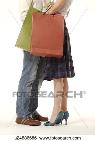 Cropped view a couple in an affectionate mood. View Large Photo Image Stock Photograph - Cropped view a couple in an affectionate mood.. Fotosearch