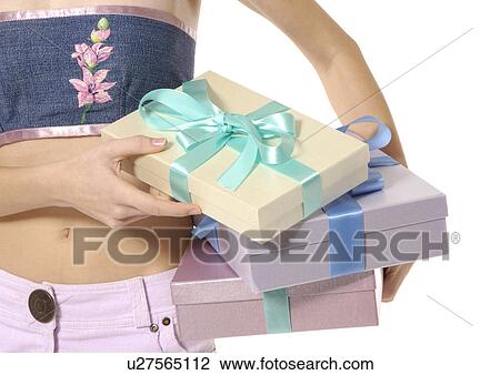 Cropped view of a woman with gifts. View Large Photo Image Stock Image - Cropped view of a woman with gifts.. Fotosearch