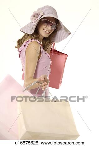 Portrait of a young woman carrying her shopping bags. View Large Photo Image Stock Photography - Portrait of a young woman carrying her shopping bags.. Fotosearch