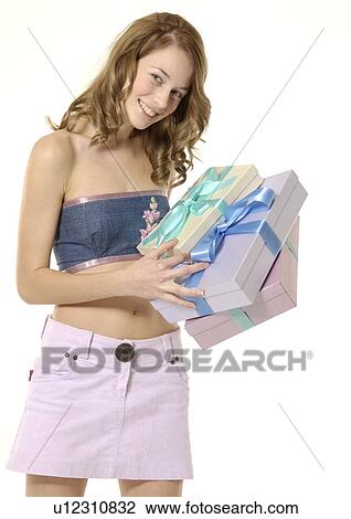 Portrait of a young woman displaying boxes of gifts. View Large Photo Image Stock Image - Portrait of a young woman displaying boxes of gifts.. Fotosearch