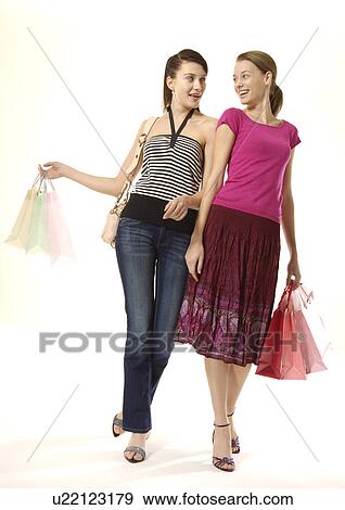 Portrait of two young women on a shopping spree. View Large Photo Image Stock Photo - Portrait of two young women on a shopping spree.. Fotosearch