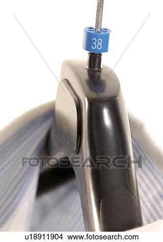 Picture - Close-up of a shirt on a hanger.. Fotosearch