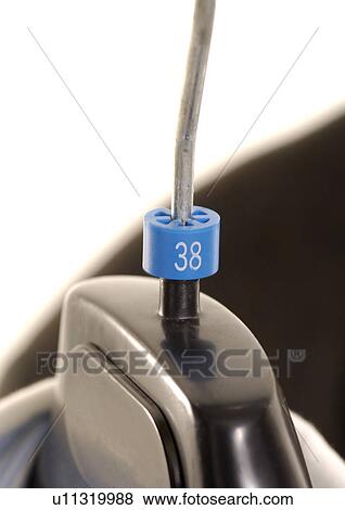 Stock Photo - Close-up of a shirt on a hanger.. Fotosearch