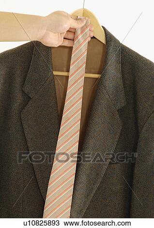 Stock Image - Cropped view of a female with a tie.. Fotosearch