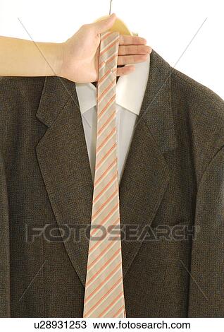 Stock Image - Cropped view of a female with a tie.. Fotosearch