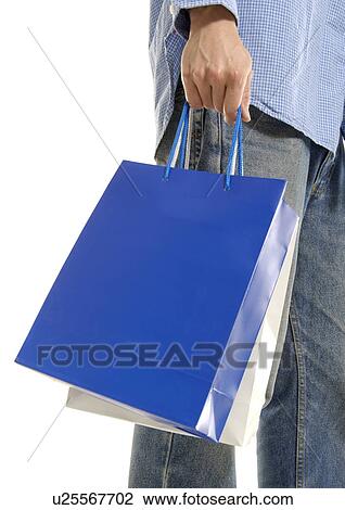 Cropped view of a man holding shopping bags. View Large Photo Image Stock Image - Cropped view of a man holding shopping bags.. Fotosearch