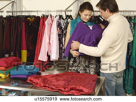 Stock Photo - View of a couple shopping in a store.. Fotosearch