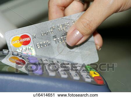 View of a person striping a credit card. View Large Photo Image Stock Image - View of a person striping a credit card.. Fotosearch