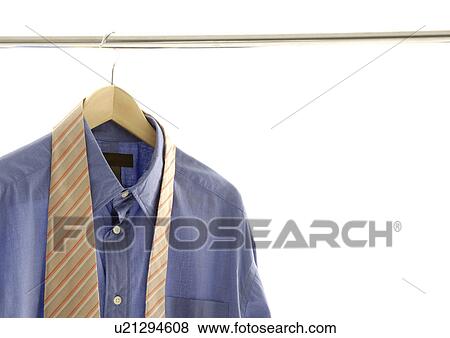 View of a shirt and a tie hung on a pipe. View Large Photo Image Stock Photo - View of a shirt and a tie hung on a pipe.. Fotosearch