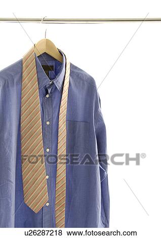 View of a shirt and a tie on a hanger. View Large Photo Image Stock Photo - View of a shirt and a tie on a hanger.. Fotosearch
