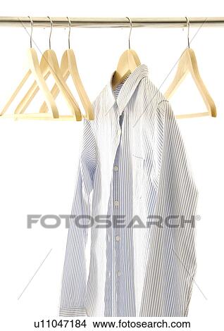 View of a shirt on a hanger. View Large Photo Image Picture - View of a shirt on a hanger.. Fotosearch