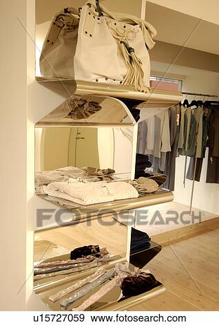 View of bags and clothes displayed at a shop. View Large Photo Image Stock Photo - View of bags and clothes displayed at a shop.. Fotosearch