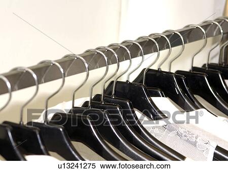 View of clothes hung on the hangers. View Large Photo Image Stock Photography - View of clothes hung on the hangers.. Fotosearch