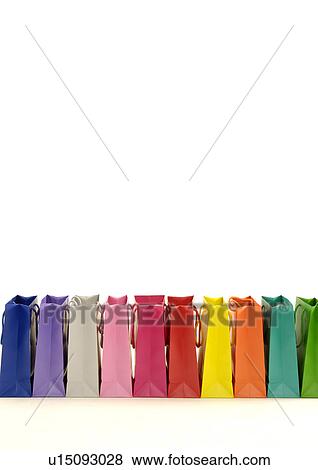 View of colorful shopping bags arranged in a row. View Large Photo Image Stock Photo - View of colorful shopping bags arranged in a row.. Fotosearch