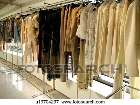 View of designer clothes displayed in a shop. View Large Photo Image Stock Photo - View of designer clothes displayed in a shop.. Fotosearch