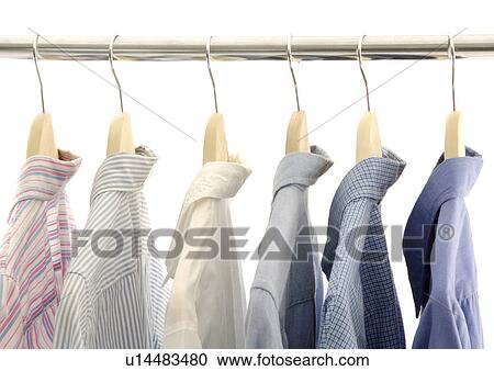 View of shirts displayed on a rod. View Large Photo Image Stock Image - View of shirts displayed on a rod.. Fotosearch