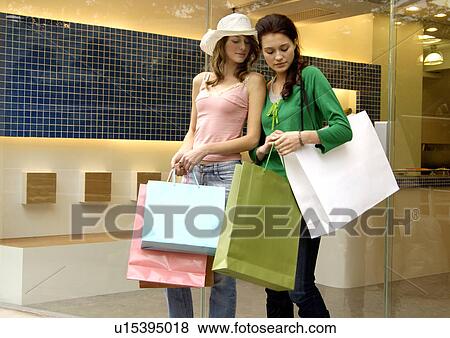 View of two women shopping together. View Large Photo Image Stock Photo - View of two women shopping together.. Fotosearch
