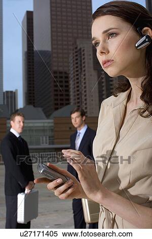 A Businesswoman Talking on the Cellular Phone Headset, Waist Up View Large Photo Image Stock Photography - A Businesswoman Talking on the Cellular Phone Headset, Waist Up. Fotosearch