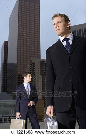 A Pair of Businessman Standing in the Downtown, Three Quarter Length, Front View View Large Photo Image Stock Photo - A Pair of Businessman Standing in the Downtown, Three Quarter Length, Front View. Fotosearch