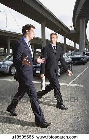 A Pair of Businessman Walking Under the Elevated Road, Full Length View Large Photo Image Stock Photography - A Pair of Businessman Walking Under the Elevated Road, Full Length. Fotosearch