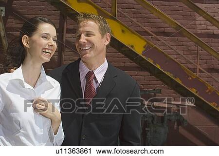 Stock Image - A Pair of Smiling Office Workers, Front View, Waist Up. Fotosearch