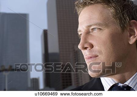 Stock Photo - Closed Up Image of a Businessman Face, Side View. Fotosearch