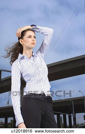 Portrait of a Young Adult Businesswoman by the Elevated Roads, Low Angle View, Three Quarter Length View Large Photo Image Stock Photograph - Portrait of a Young Adult Businesswoman by the Elevated Roads, Low Angle View, Three Quarter Length. Fotosearch