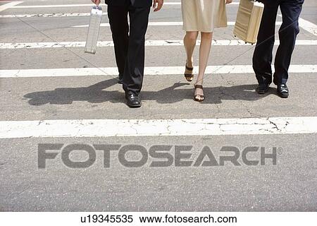 Three Office Workers Walking the Pedestrian Crossing, High Angle View, Waist Down View Large Photo Image Stock Photography - Three Office Workers Walking the Pedestrian Crossing, High Angle View, Waist Down. Fotosearch