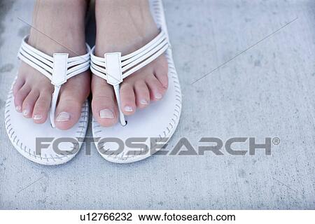 Woman's feet wearing beach sandals, Close Up, High Angle View, Copy Space View Large Photo Image Stock Image - Woman's feet wearing beach sandals, Close Up, High Angle View, Copy Space. Fotosearch