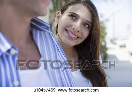 Young adult couple, Side View, Differential Focus View Large Photo Image Stock Photo - Young adult couple, Side View, Differential Focus. Fotosearch