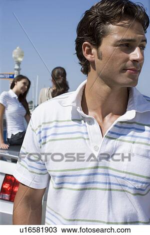 Young adult man and women sitting behind, Front View, Side View, Rear View, Differential Focus View Large Photo Image Stock Image - Young adult man and women sitting behind, Front View, Side View, Rear View, Differential Focus. Fotosearch