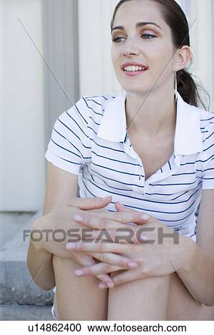 Young adult woman sitting, Front View View Large Photo Image Stock Image - Young adult woman sitting, Front View. Fotosearch