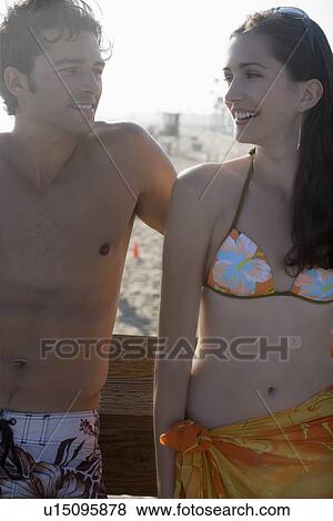 Young adult couple leaning on railing, Front View View Large Photo Image Stock Photo - Young adult couple leaning on railing, Front View. Fotosearch