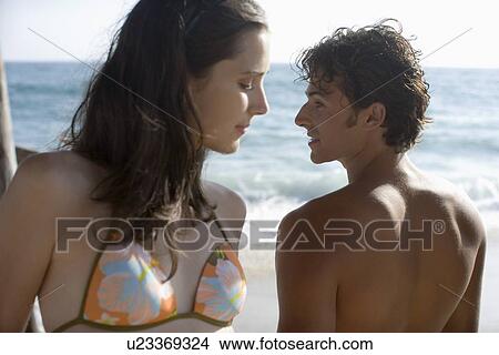 Young adult couple on beach, Front View, Rear View, Differential Focus View Large Photo Image Picture - Young adult couple on beach, Front View, Rear View, Differential Focus . Fotosearch