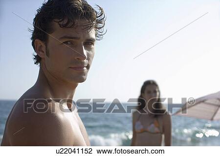 Young adult couple on beach, Front View, Side View, Differential Focus View Large Photo Image Stock Image - Young adult couple on beach, Front View, Side View, Differential Focus . Fotosearch