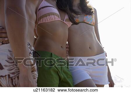 Young adult people in swimming wears, Side View View Large Photo Image Stock Image - Young adult people in swimming wears, Side View. Fotosearch