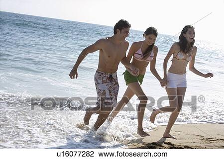 Young adult people on beach, Side View View Large Photo Image Stock Image - Young adult people on beach, Side View. Fotosearch