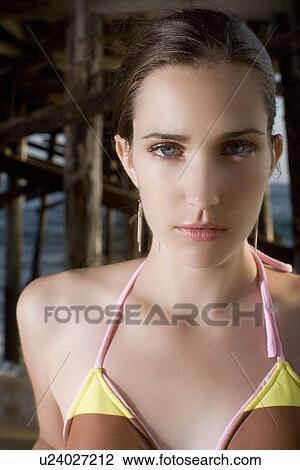 Young adult woman in bikini looking at camera under a bridge, Front View View Large Photo Image Stock Image - Young adult woman in bikini looking at camera under a bridge, Front View. Fotosearch