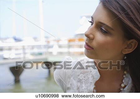 Young adult woman looking away, Side View, Differential Focus, In Focus, Out Focus View Large Photo Image Stock Photo - Young adult woman looking away, Side View, Differential Focus, In Focus, Out Focus. Fotosearch