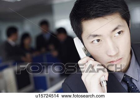 Close-up of a businessman talking on the telephone View Large Photo Image Picture - Close-up of a businessman talking on the telephone. Fotosearch